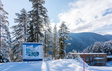 Bansko, Bulgaria - February 14, 2020: Winter ski resort Bansko, ski slope, people skiing and mountains view.のeditorial素材