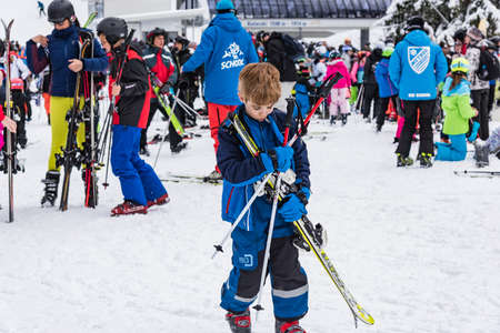 Bansko, Bulgaria - February 14, 2020: Winter ski resort Bansko, ski slope, people skiing and mountains view.のeditorial素材
