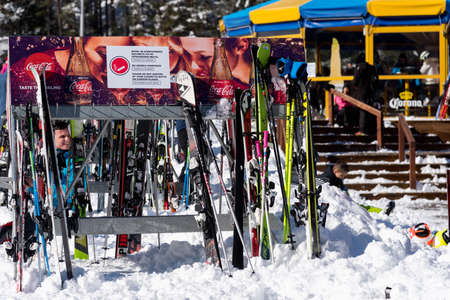 Bulgaria. Bansko. 12 February 2020.Bansko ski station, Kolarski ski lift at Banderishka polyana, skiers on ski slopes, mountain. With pine trees, people. Snowのeditorial素材