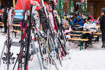 Bulgaria. Bansko. 12 February 2020.Bansko ski station, Kolarski ski lift at Banderishka polyana, skiers on ski slopes, mountain. With pine trees, people. Snowのeditorial素材