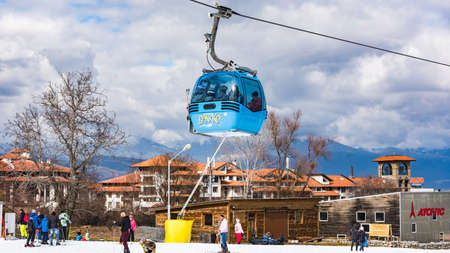 Bansko, Bulgaria - February 14, 2020: Winter ski resort Bansko, ski slope, people skiing and mountains view.のeditorial素材