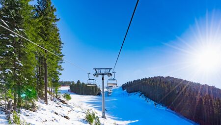 chair lift for skiing in the mountains in winterの写真素材