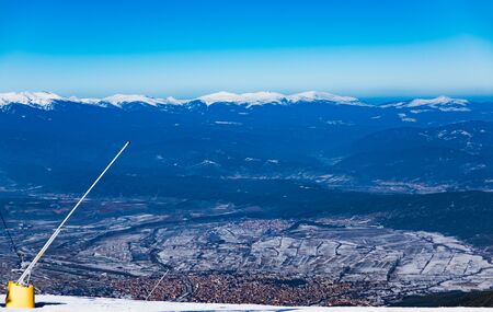 View of the city of Bansko from the top of Pirin Mountain. Misty morning of a ski resort in Bulgariaの写真素材