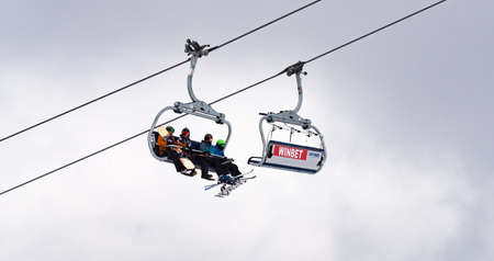 Bulgaria. Bansko. 10 February 2020.Ski resort in Bansko. Snowy ski slopes and  chair ski lifts station in  winter mountain ski resort. Under blue sky on sunny dayのeditorial素材