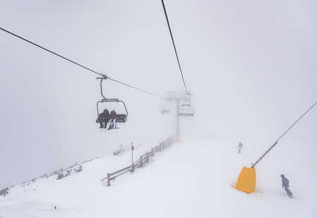 Bulgaria. Bansko. 10 February 2020.Ski resort in Bansko. Snowy ski slopes and  chair ski lifts station in  winter mountain ski resort. Under blue sky on sunny dayのeditorial素材