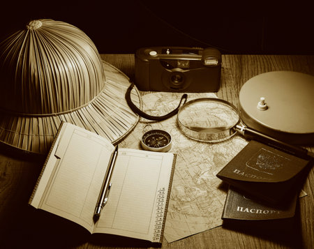 planning travel on vacation along with a map, compass, camera, notepad.の写真素材