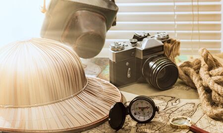planning travel on vacation along with a map, compass, camera, notepad.の写真素材