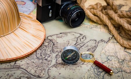 planning travel on vacation along with a map, compass, camera, notepad.の写真素材