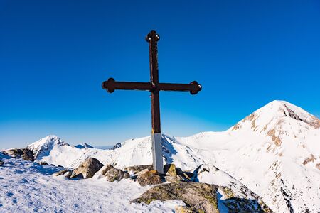 wooden christian cross on top of the mountain commemorative symbolの写真素材