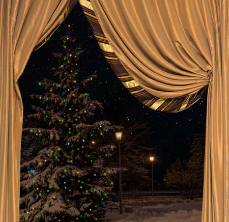 view from the window before the holiday Christmas tree is decorated with a colorful garlandの写真素材