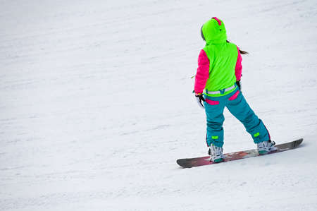 Russia. Sheregesh. 14 February 2021 skier riding down the huge snowfield splashing powder snow.のeditorial素材