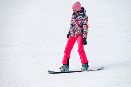 Russia. Sheregesh. 14 February 2021 skier riding down the huge snowfield splashing powder snow.