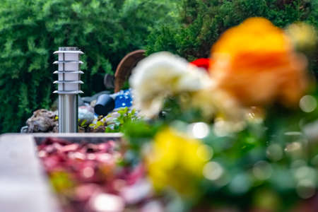 small lantern in a garden on the groundの写真素材