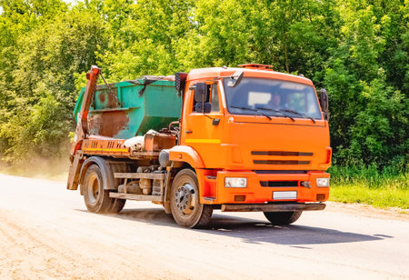 Specialized car removes waste garbage from the streets of the city