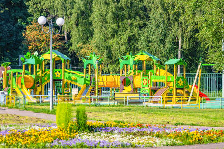 swing carousel in the park for children outdoors in summerの写真素材