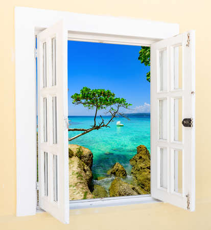 old wooden open window overlooking the tropicsの写真素材