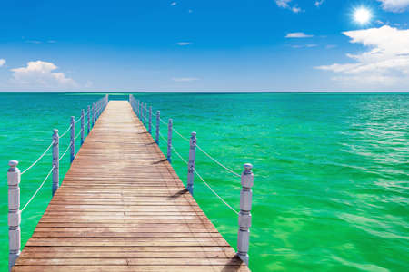 sandy beach and calm blue Caribbean sea surf Dominican Republicの写真素材