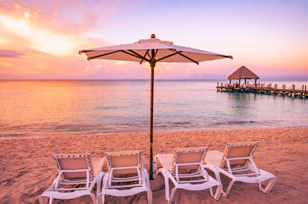 beautiful view of the sea sunset caribbean sea in the dominican republic a pier with a gazeboの写真素材