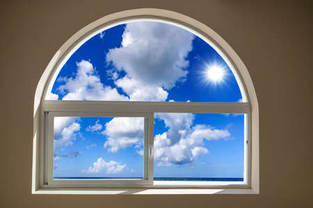 open window view of the sky with clouds sunriseの写真素材