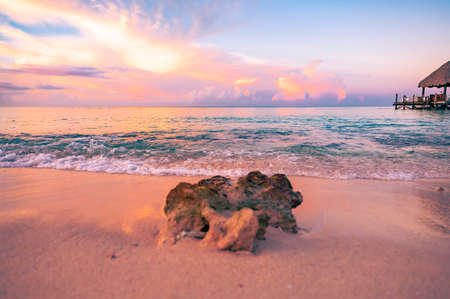 beautiful view of the sea sunset caribbean sea in the dominican republic a pier with a gazeboの写真素材