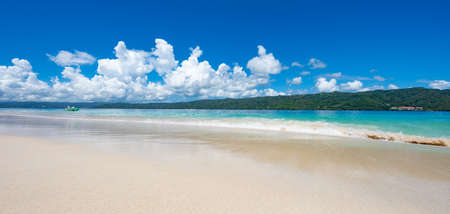 landscape paradise beach bokardi island sandy coast of the bay against the sky with cloudsの写真素材