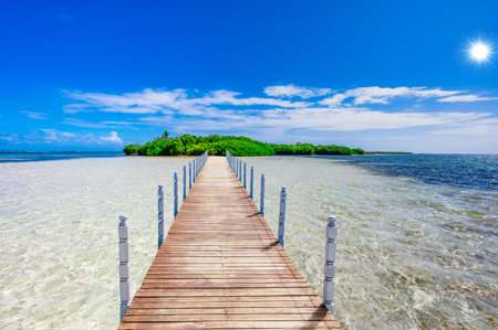 sandy beach and calm blue Caribbean sea surf Dominican Republicの写真素材