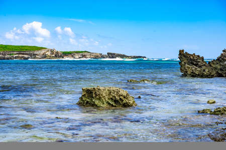 small uninhabited island of Catalinita in the Caribbean and the Atlantic Ocean on the borderの写真素材