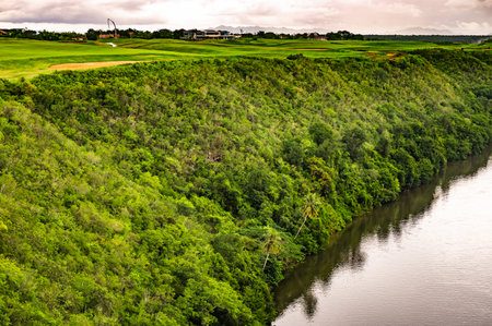 calm beautiful river chevon among tropical jungle high bank dominican republicの写真素材