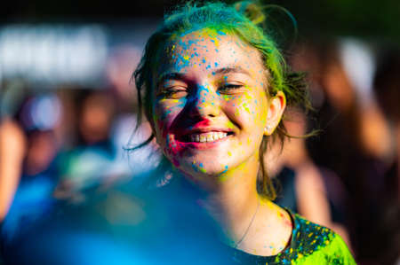 Russia, Chekhov, July 2, 2022. Cheerful youth holiday Holi spilling colorful paintsのeditorial素材