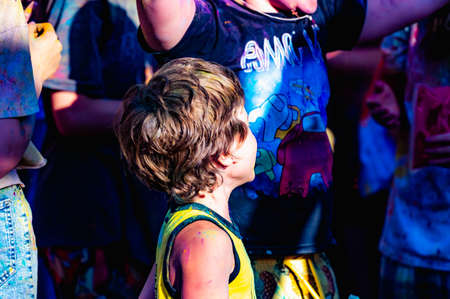 Russia, Chekhov, July 2, 2022. Cheerful youth holiday Holi spilling colorful paintsのeditorial素材