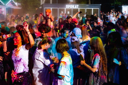 Russia, Chekhov, July 2, 2022. Cheerful youth holiday Holi spilling colorful paintsのeditorial素材