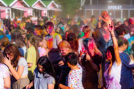 Russia, Chekhov, July 2, 2022. Cheerful youth holiday Holi spilling colorful paintsのeditorial素材