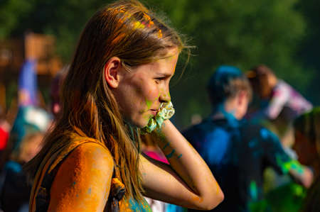 Russia, Chekhov, July 2, 2022. Cheerful youth holiday Holi spilling colorful paintsのeditorial素材