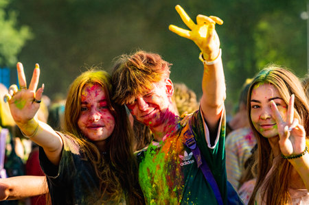 Russia, Chekhov, July 2, 2022. Cheerful youth holiday Holi spilling colorful paintsのeditorial素材