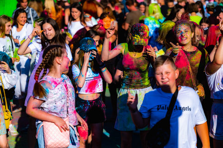 Russia, Chekhov, July 2, 2022. Cheerful youth holiday Holi spilling colorful paintsのeditorial素材