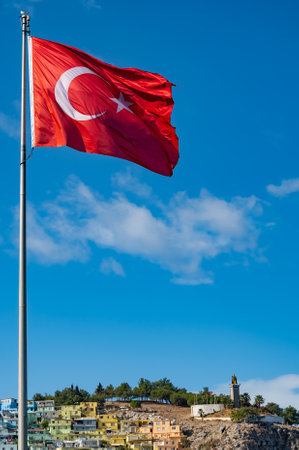 Homes along and turkish flag the Kusadasi Turkeyの写真素材