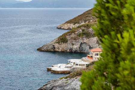 landscape rocky coast of the Aegean sea with green vegetationの写真素材