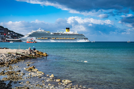 09/27/2022 Turkey, Kusadasi.sea cruise liner moored in the port of the cityのeditorial素材