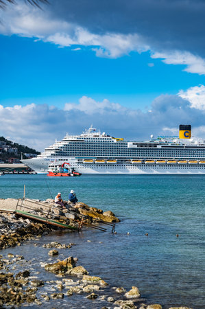 09/27/2022 Turkey, Kusadasi.sea cruise liner moored in the port of the cityのeditorial素材