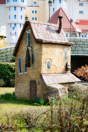 A house with a blue roof and a lamp on the roof. The house is old and has a rustic feel to itの写真素材
