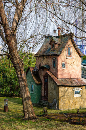 A house with a blue roof and a lamp on the roof. The house is old and has a rustic feel to itの写真素材