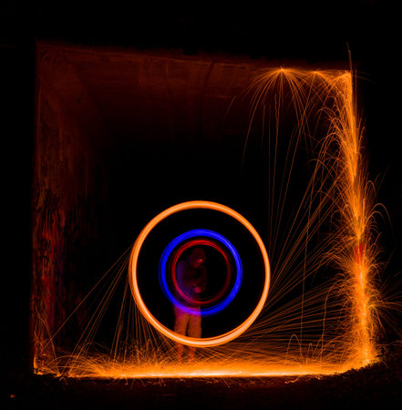 Welding of metal structures with sparks flying in the air.