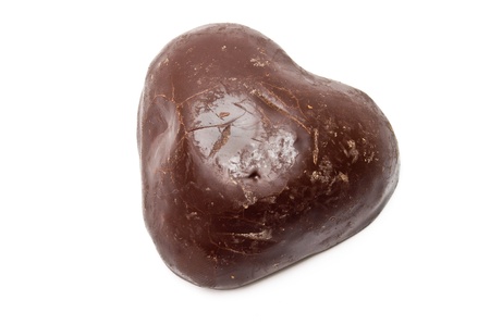 Single scratched chocolate heart isolated on whiteの写真素材