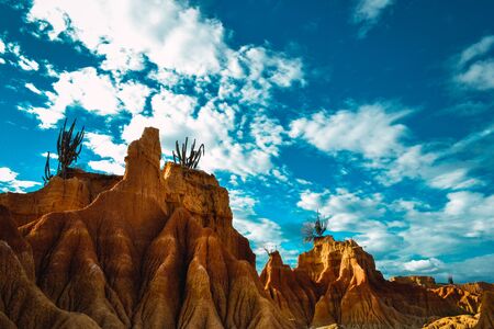 A tall rock in the Tatacoa Desert, Colombia under the cloudy skyの写真素材