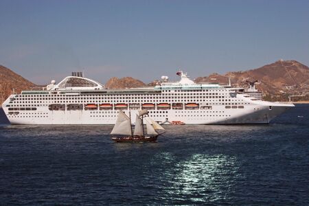 Cruise Ship and Sail Boatの写真素材