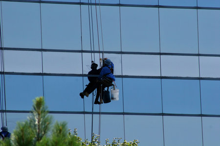 Window washer on side of highrise