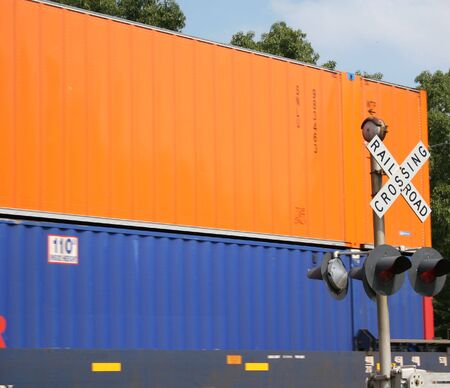 Orange and blue freight train carsの写真素材