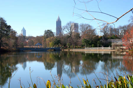 City skyline reflected in city park lakeの写真素材