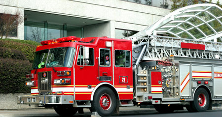 A red fire truck at the scene of an emergency
