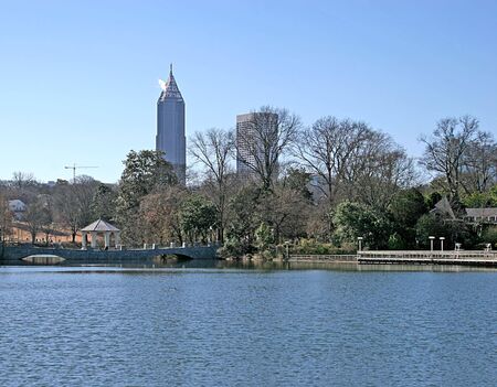 A city park in winter with city skyline in backgroundの写真素材